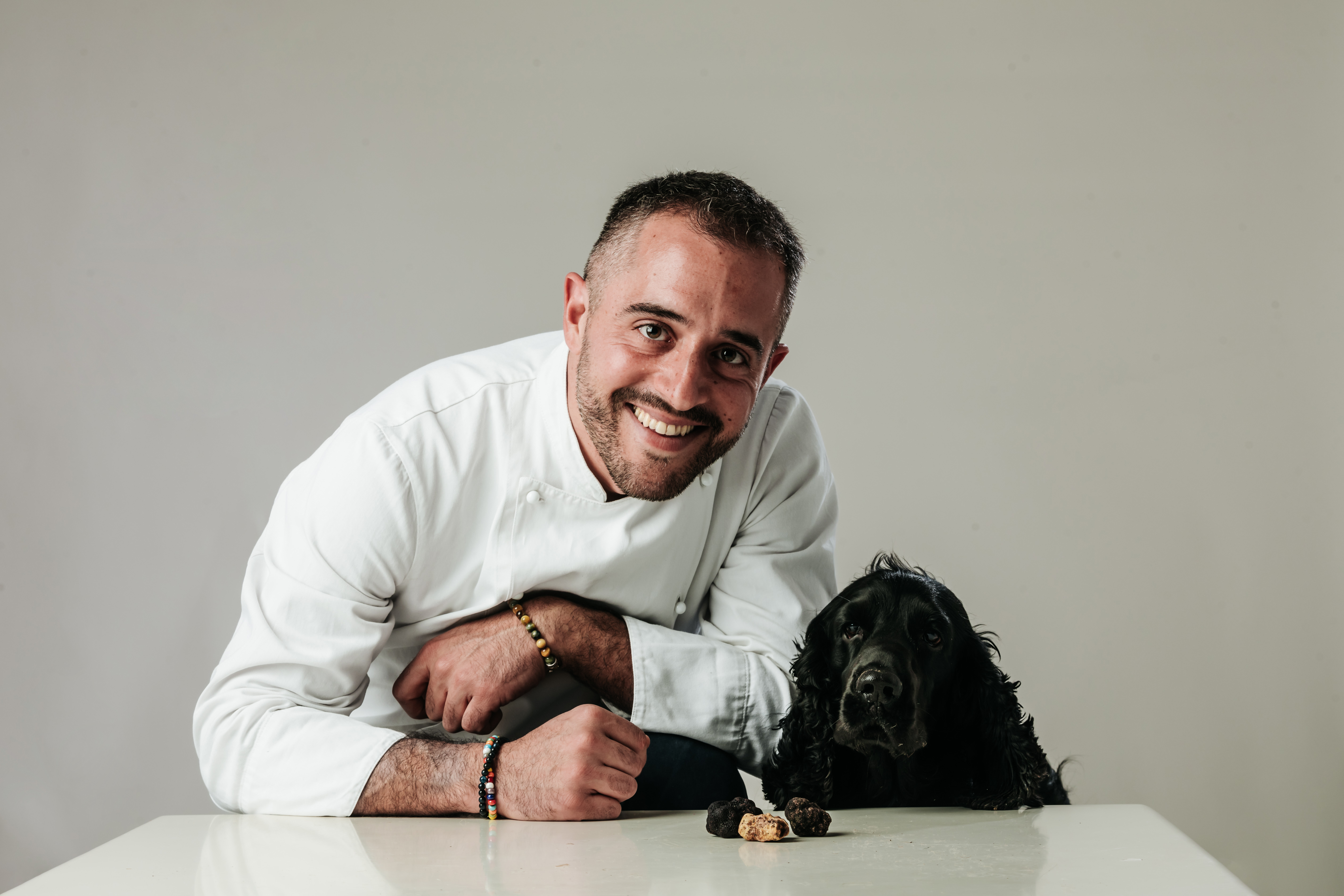 Chef Giacomo Boccaccini and Lupo the truffle dog in the woods of Corella 136, Dicomano Tuscany